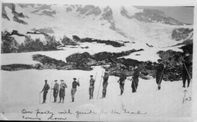 A long line of men coming down out of the mountains stare out at you. The man at the end of the line in the picture is identified with the letters JMS.